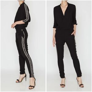 Chic Black Jumpsuit with Silver Detailing